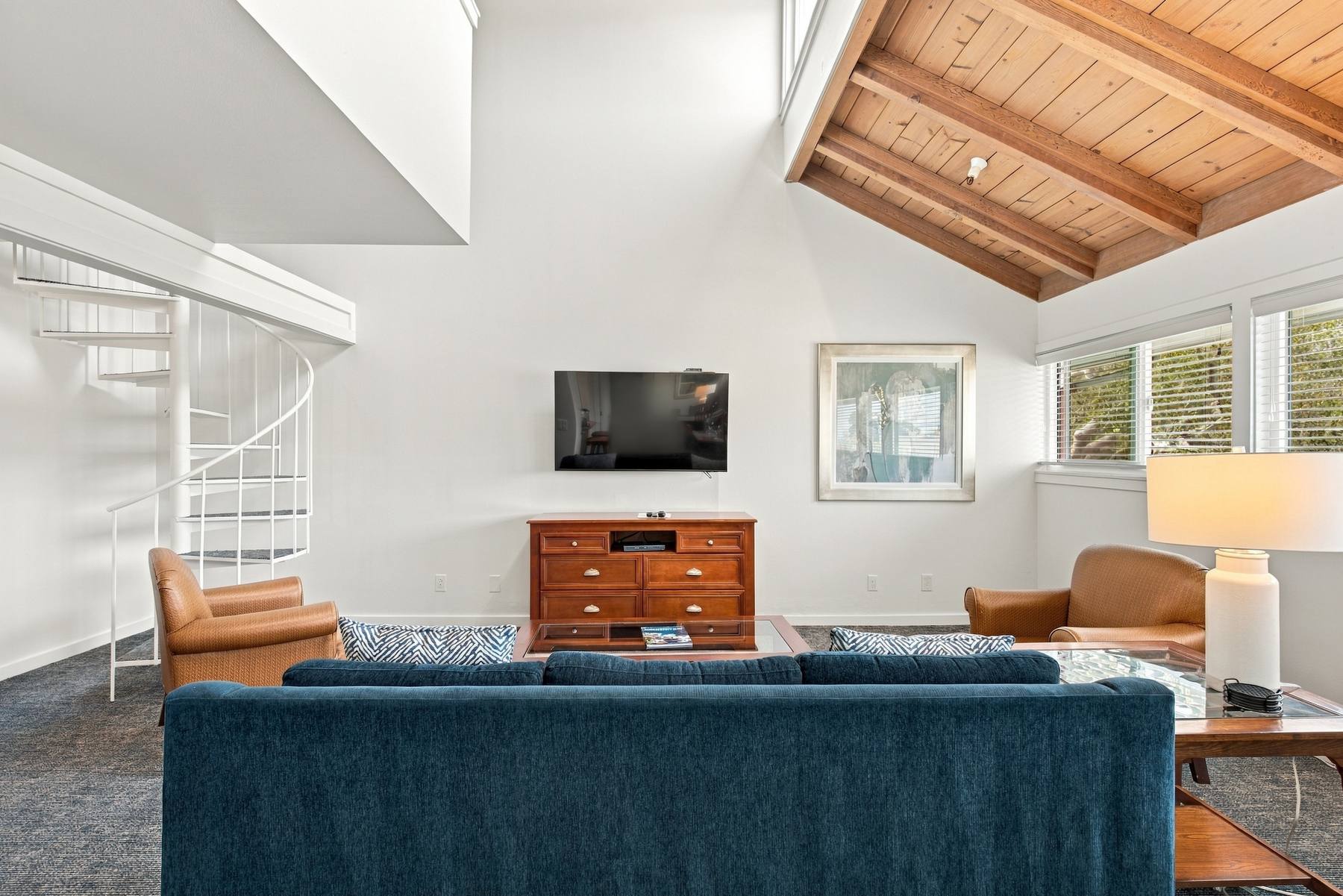Unit B-1 living room under the vaulted wood ceiling