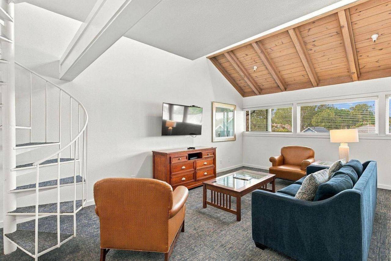 Unit B-1 living room under the vaulted cedar ceiling